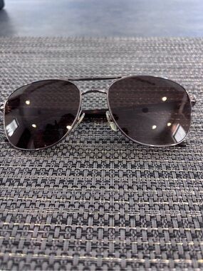Gucci Silver Frame gun metal Lens Aviator Sunglasses with tortoise pattern.